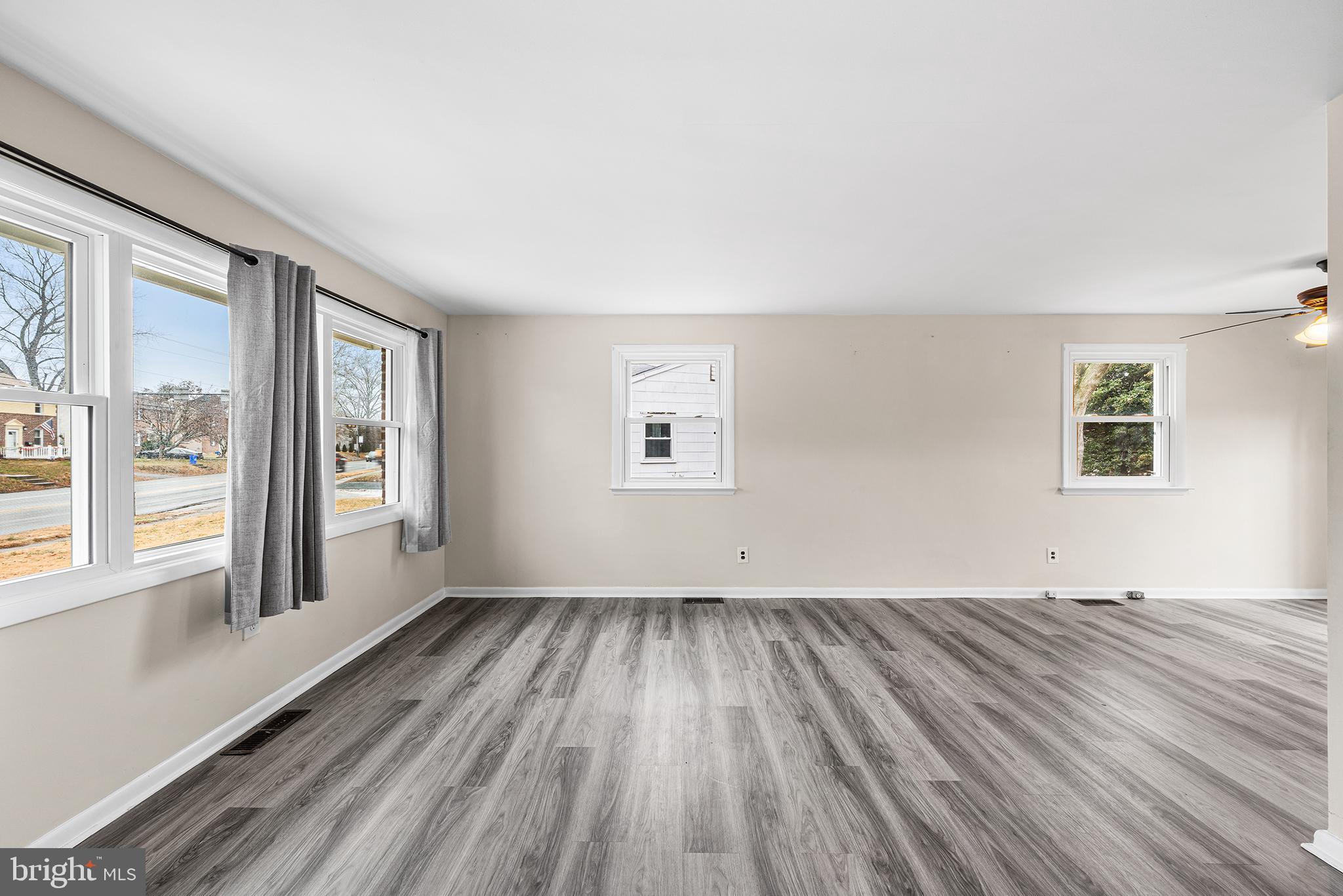 1108 Providence Road Secane, PA 19018 - Photo 5 of 33 wooden floor in an empty room with a window