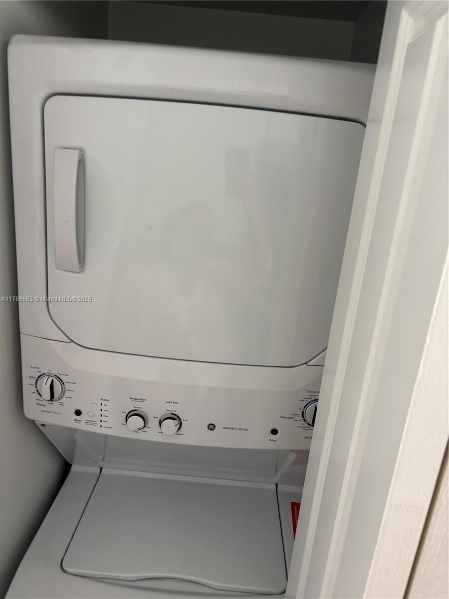 2415 Northwest 16th St Road, Unit 103 Miami, FL 33125 - Photo 15 of 42 a close up view of a washer and dryer