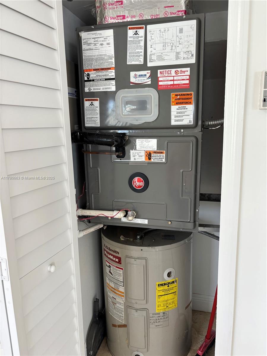 2415 Northwest 16th St Road, Unit 103 Miami, FL 33125 - Photo 16 of 42 a close view of washer and dryer