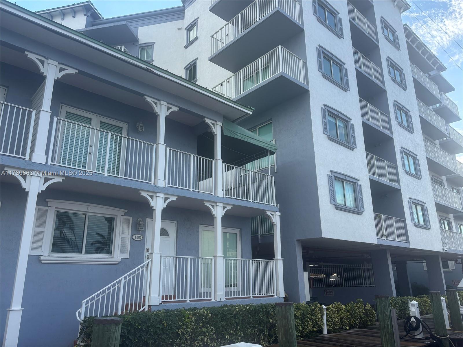 2415 Northwest 16th St Road, Unit 103 Miami, FL 33125 - Photo 2 of 42 front view of a building