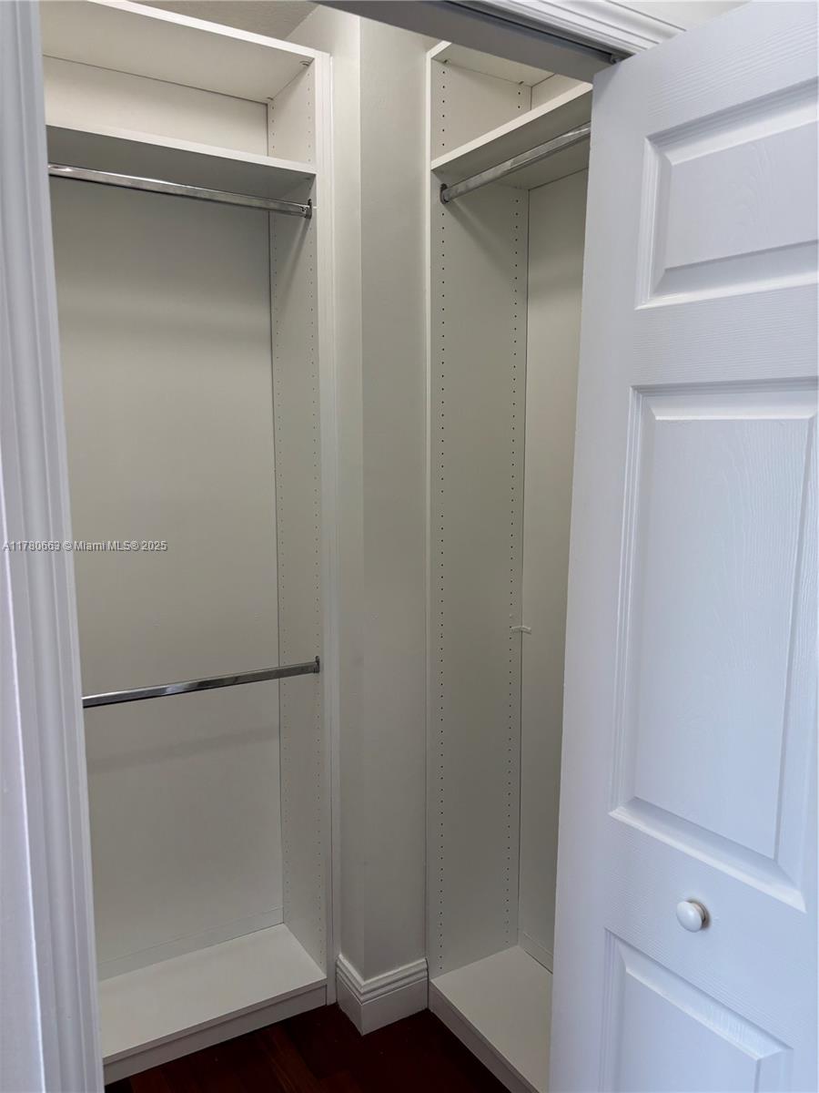 2415 Northwest 16th St Road, Unit 103 Miami, FL 33125 - Photo 21 of 42 a bathroom with a glass shower door