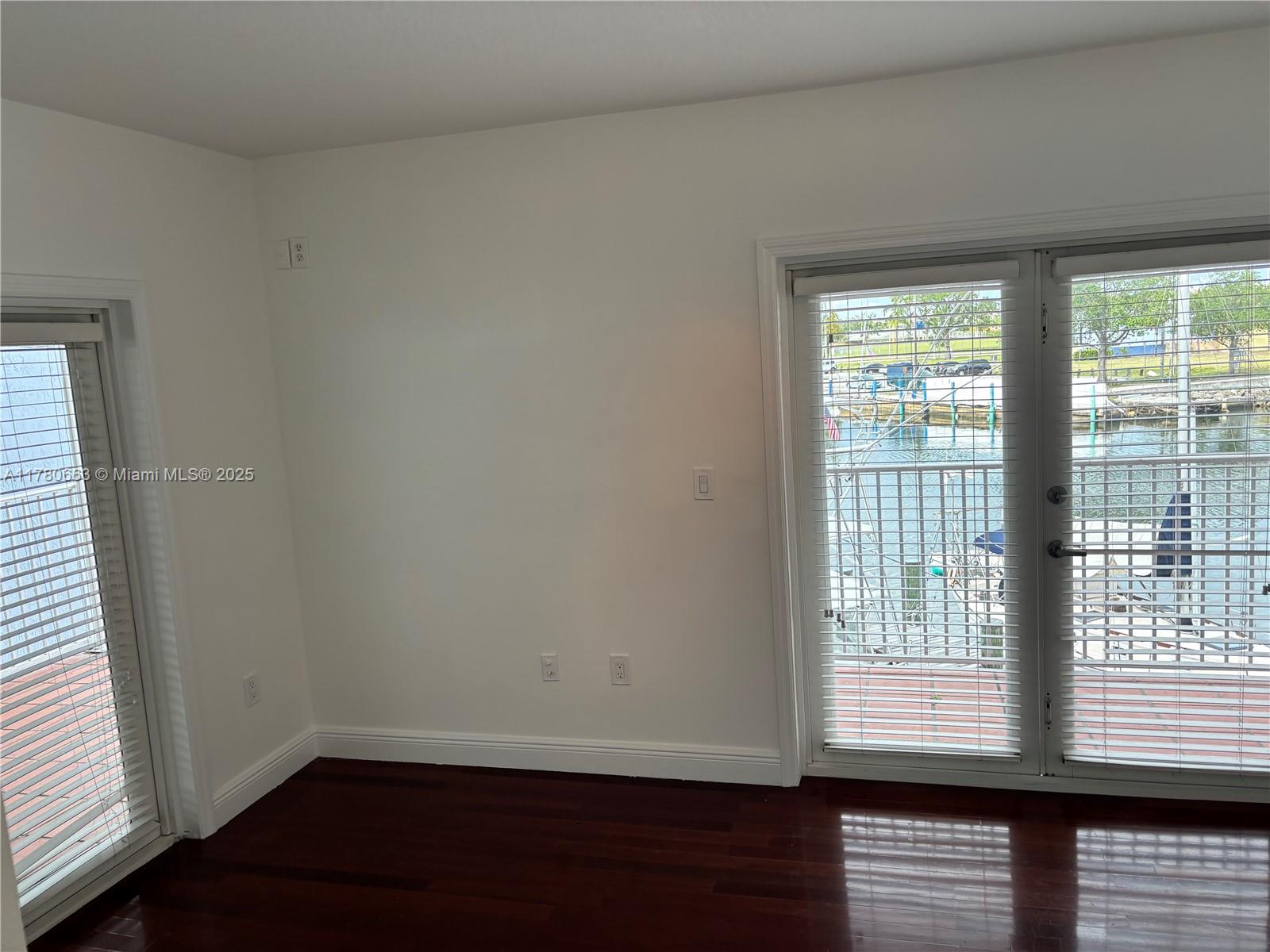 2415 Northwest 16th St Road, Unit 103 Miami, FL 33125 - Photo 25 of 42 a view of an empty room with a window