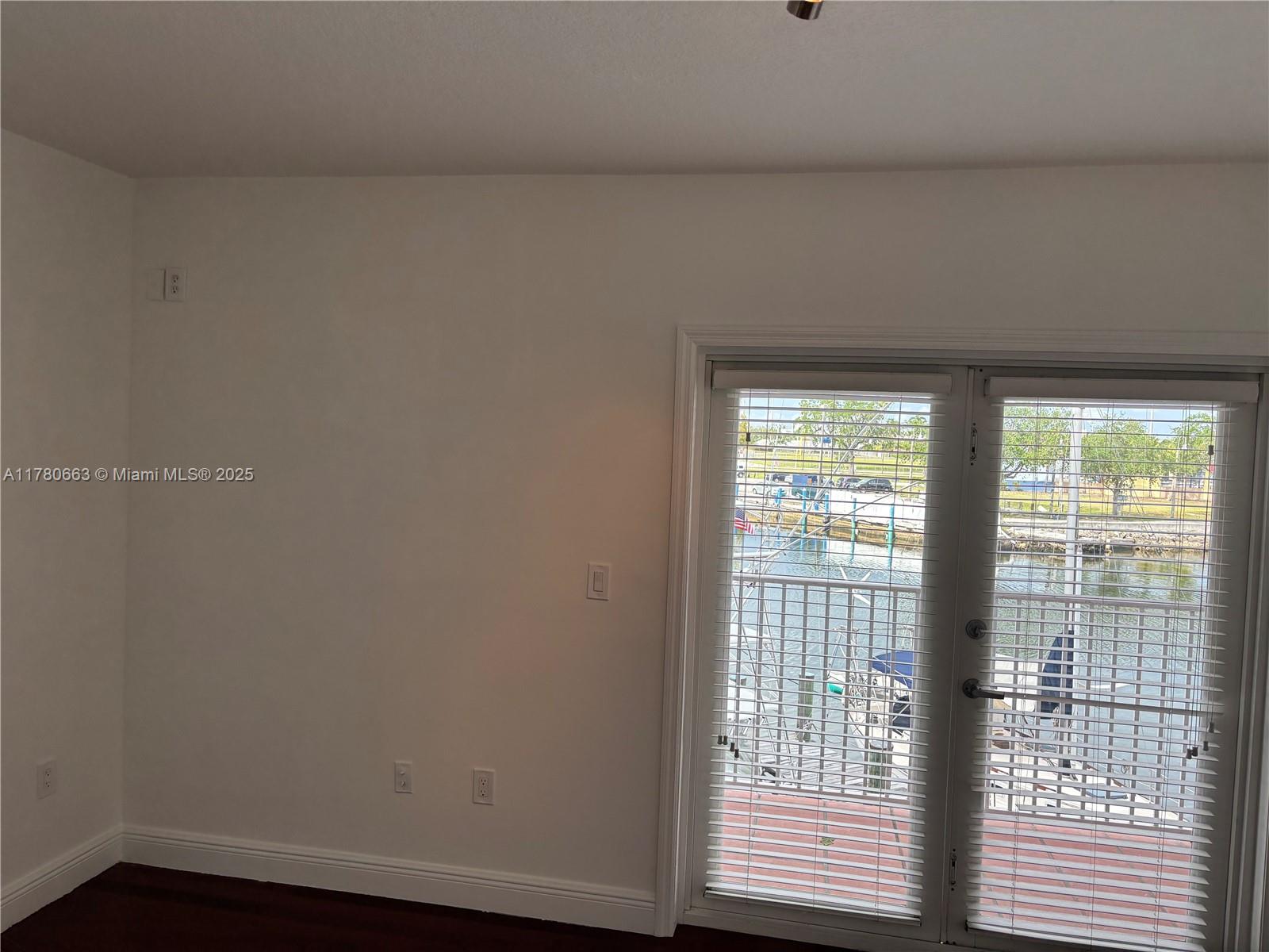 2415 Northwest 16th St Road, Unit 103 Miami, FL 33125 - Photo 27 of 42 a view of an empty room with a window