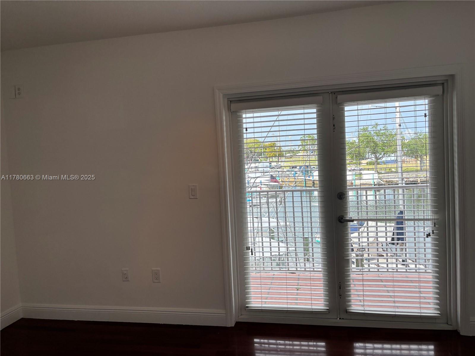 2415 Northwest 16th St Road, Unit 103 Miami, FL 33125 - Photo 28 of 42 a view of an empty room with a window