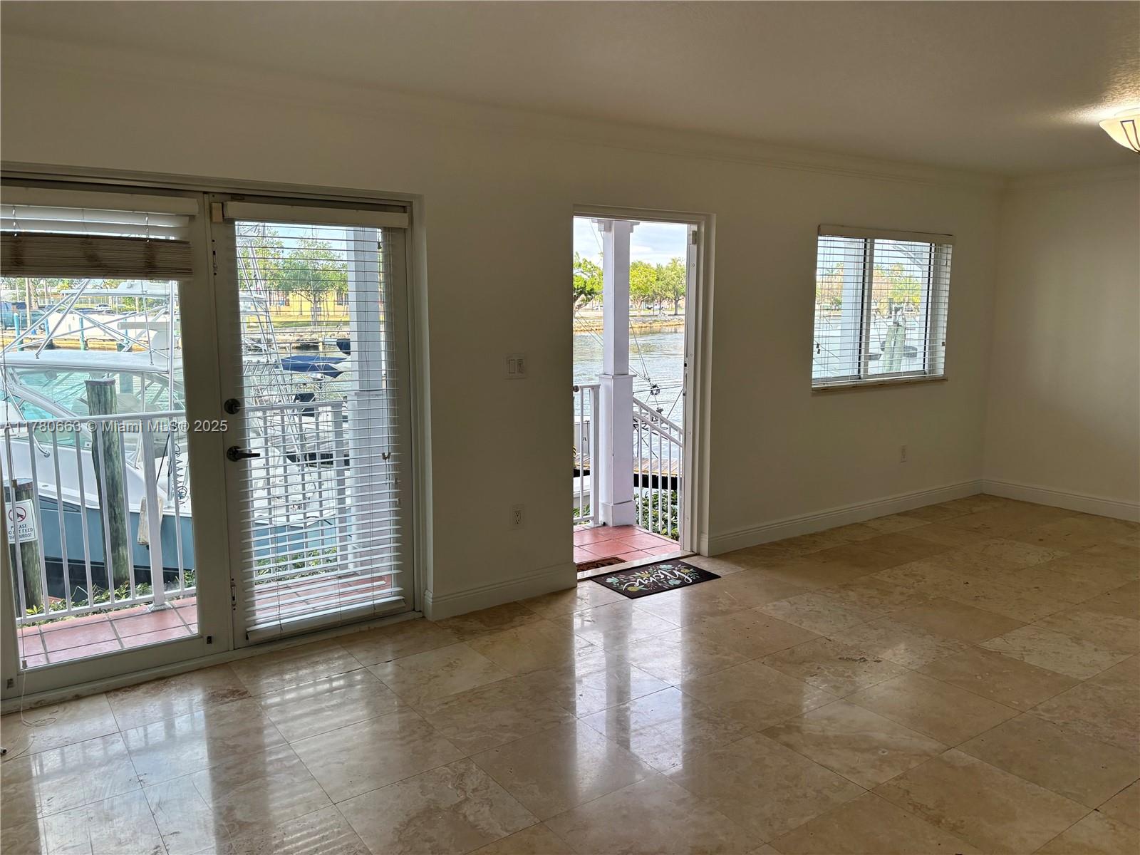 2415 Northwest 16th St Road, Unit 103 Miami, FL 33125 - Photo 3 of 42 a view of livingroom with front door