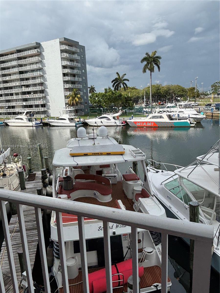2415 Northwest 16th St Road, Unit 103 Miami, FL 33125 - Photo 32 of 42 a view of swimming pool with outdoor seating and city view
