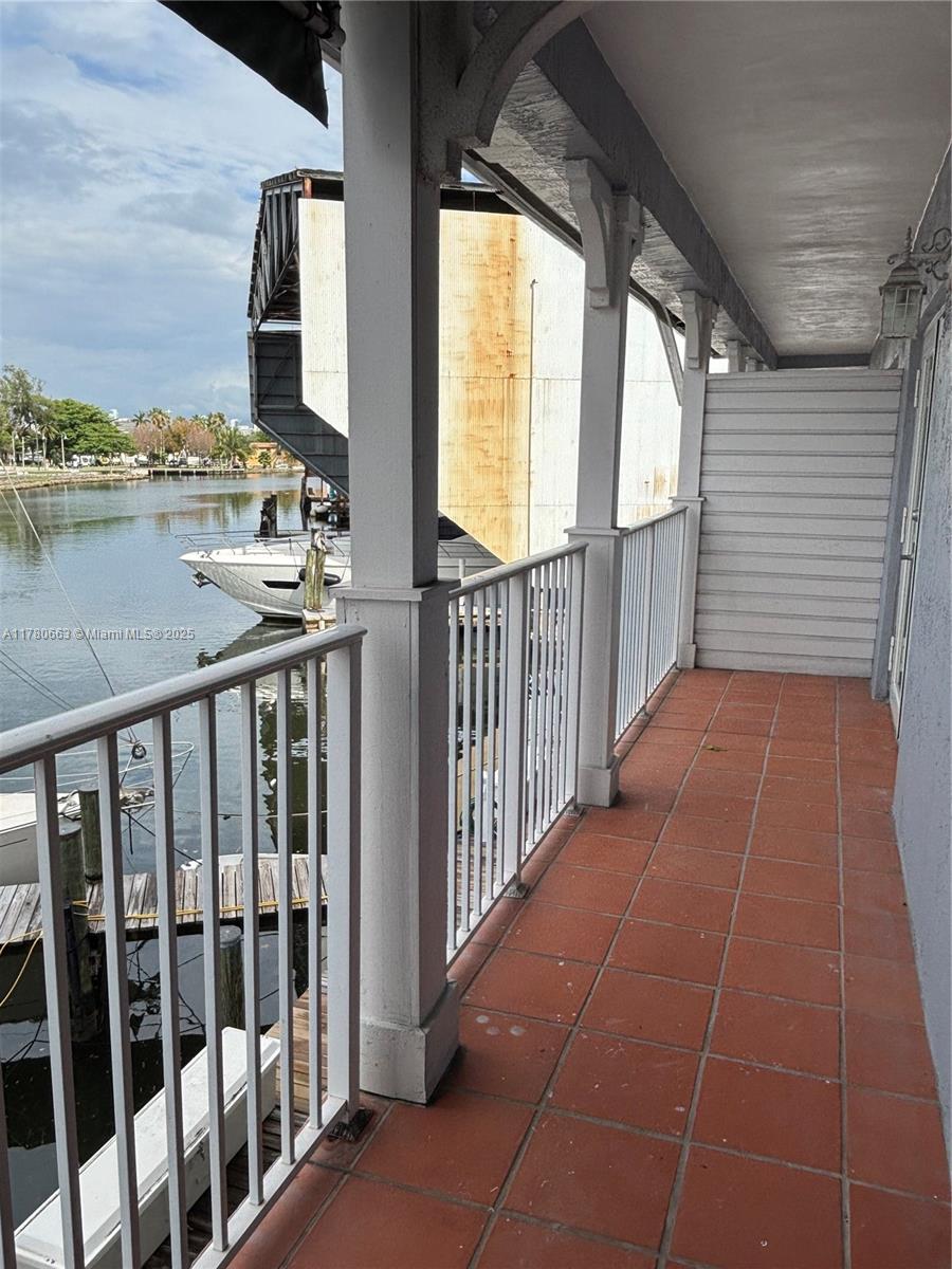 2415 Northwest 16th St Road, Unit 103 Miami, FL 33125 - Photo 33 of 42 a balcony with view of barbecue area