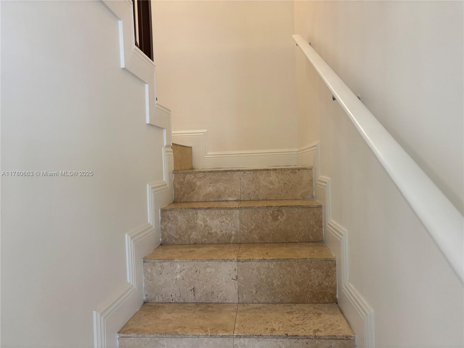 2415 Northwest 16th St Road, Unit 103 Miami, FL 33125 - Photo 35 of 42 a view of staircase with white walls