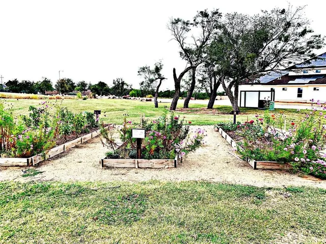 a view of a patio with a table chairs and a backyard