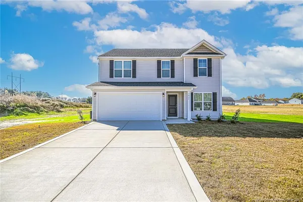 a view of a yard in front of the house