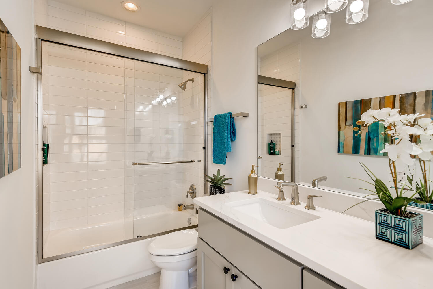 505 Kemp Street Austin, TX 78741 - Photo 21 of 34 A clean full bath upstairs with bright tile, quartz counter, and modern finishes.