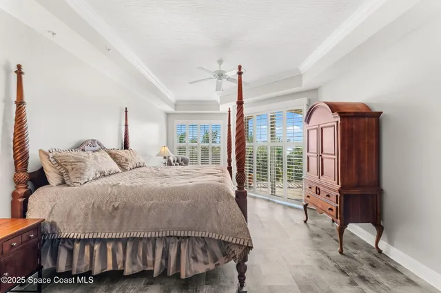 a bedroom with a bed chair and window