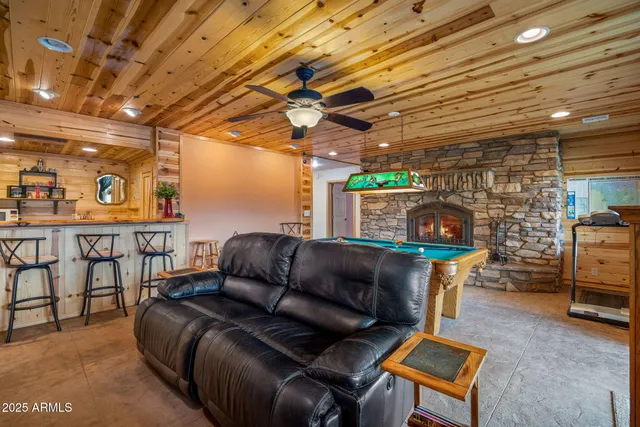 a living room with furniture a fireplace and a fireplace