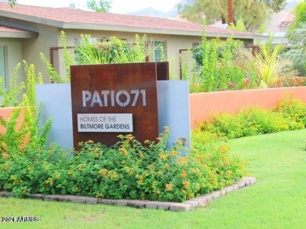 a sign broad in front of a house