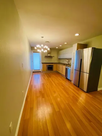 a view of a kitchen with a sink