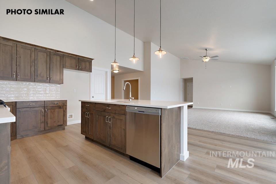 1645 Haystack Emmett, ID 83617 - Photo 11 of 33 Kitchen featuring wood-finish cabinetry, white countertops, and a subway tile backsplash