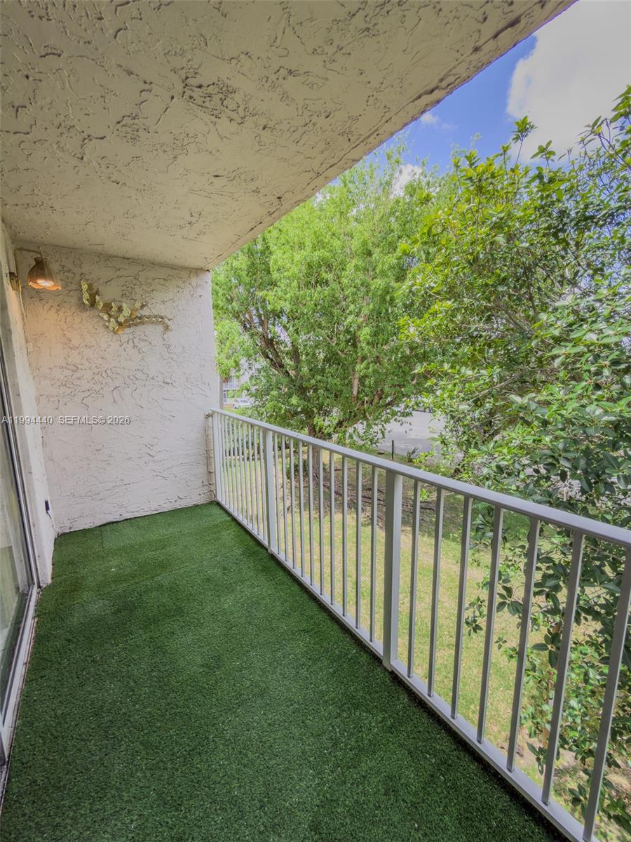 8411 Northwest 8th Street, Unit 301 Miami, FL 33126 - Photo 11 of 15 a view of a balcony with an outdoor space