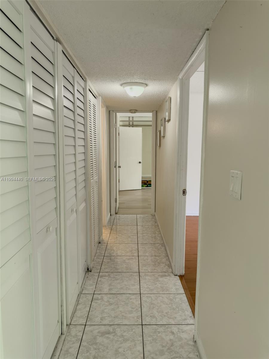 8411 Northwest 8th Street, Unit 301 Miami, FL 33126 - Photo 5 of 15 a bathroom with a glass door shower