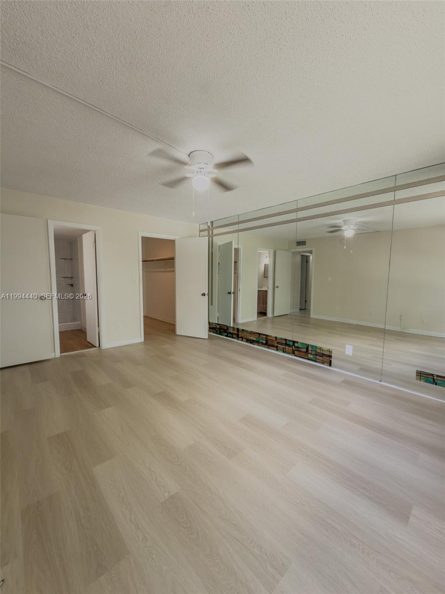 8411 Northwest 8th Street, Unit 301 Miami, FL 33126 - Photo 8 of 15 a view of a livingroom with a staircase