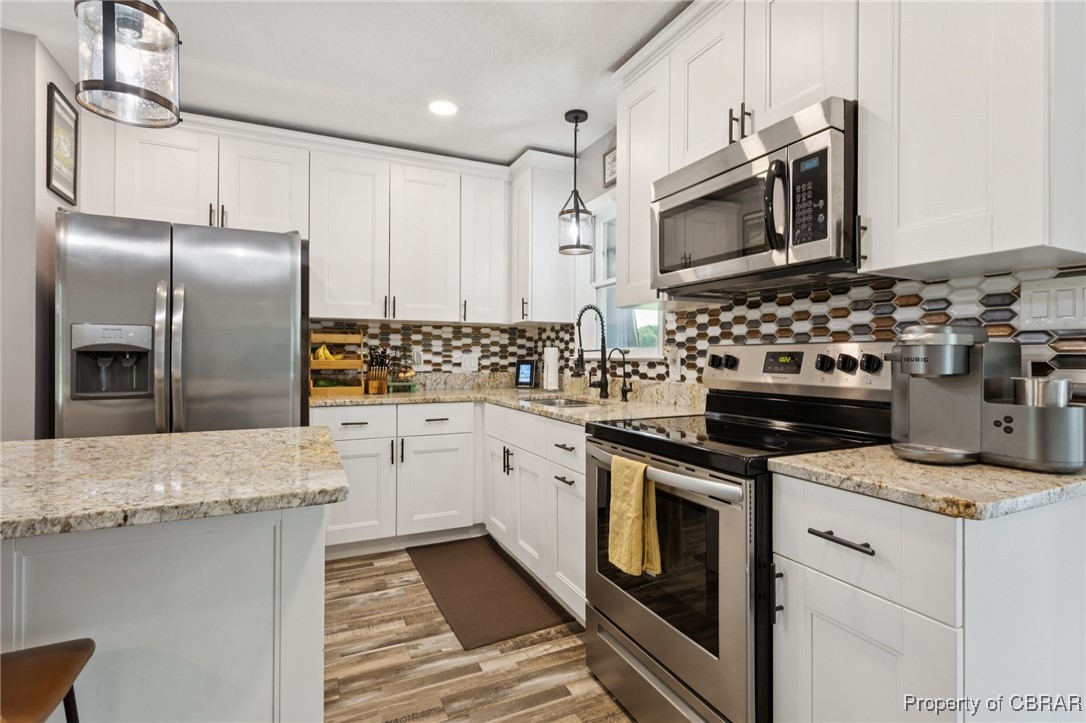 2063 Riley Lane Hayes, VA 23072 - Photo 8 of 35 Kitchen featuring stainless steel appliances, white cabinetry, and recessed lighting