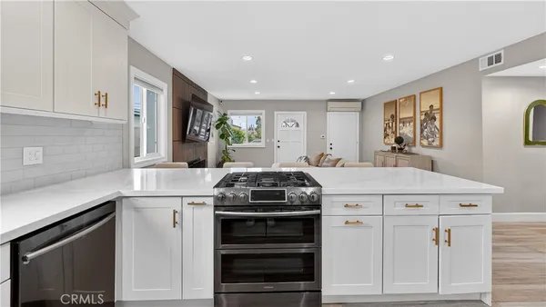 a kitchen with a stove and a sink