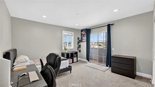 a view of a livingroom with furniture and windows