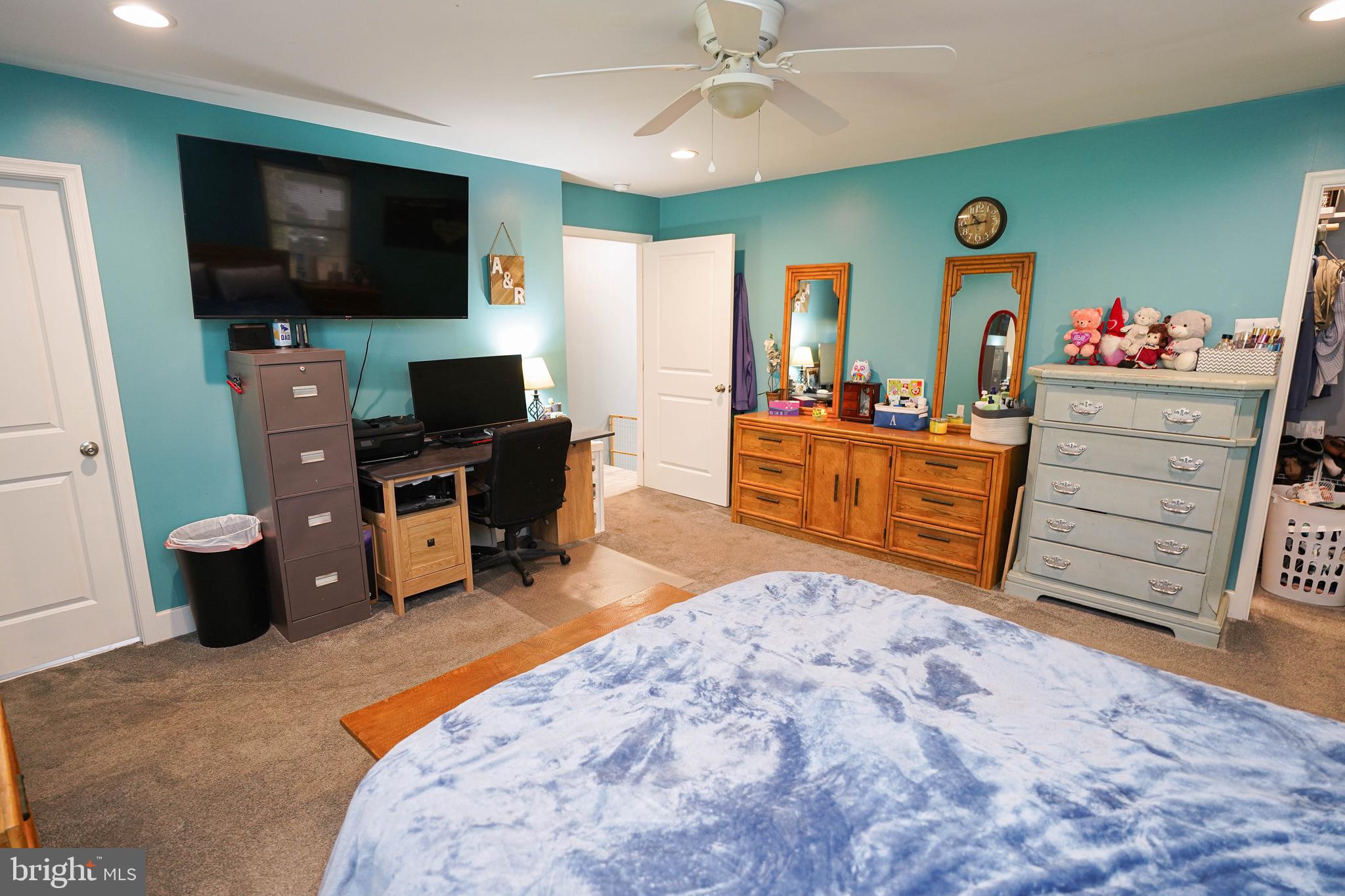 29325 West Line Road Delmar, MD 21875 - Photo 23 of 48 a living room with furniture a flat screen tv and a dresser