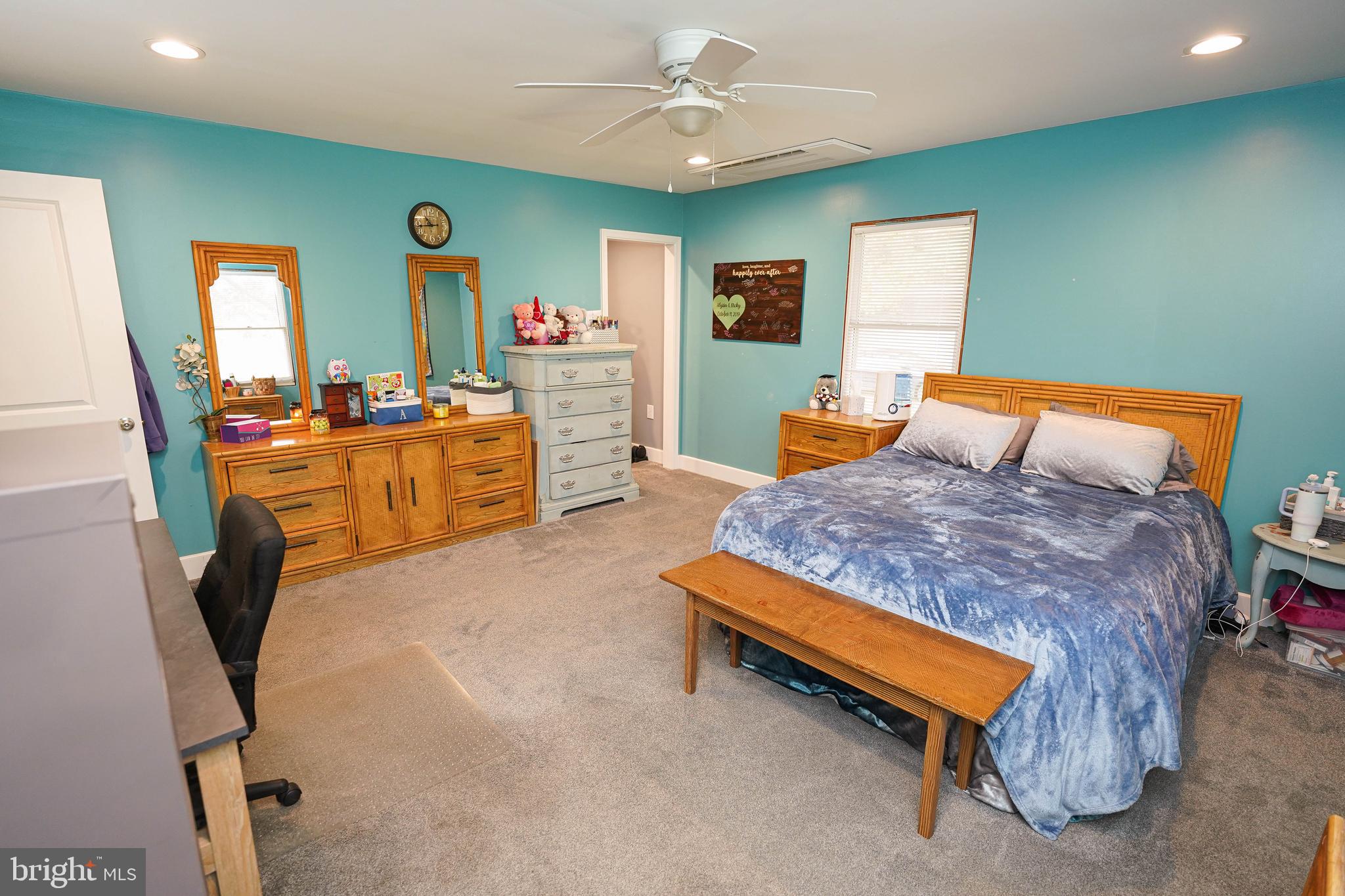 29325 West Line Road Delmar, MD 21875 - Photo 24 of 48 a bedroom with furniture and a chandelier