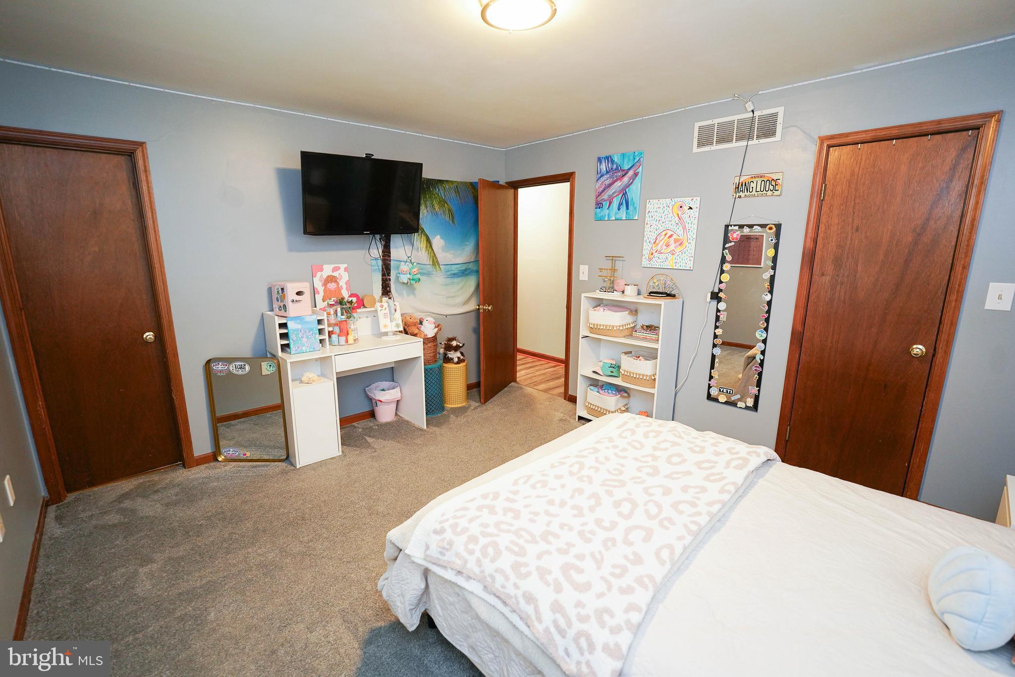 29325 West Line Road Delmar, MD 21875 - Photo 32 of 48 a bedroom with a bed and a flat screen tv