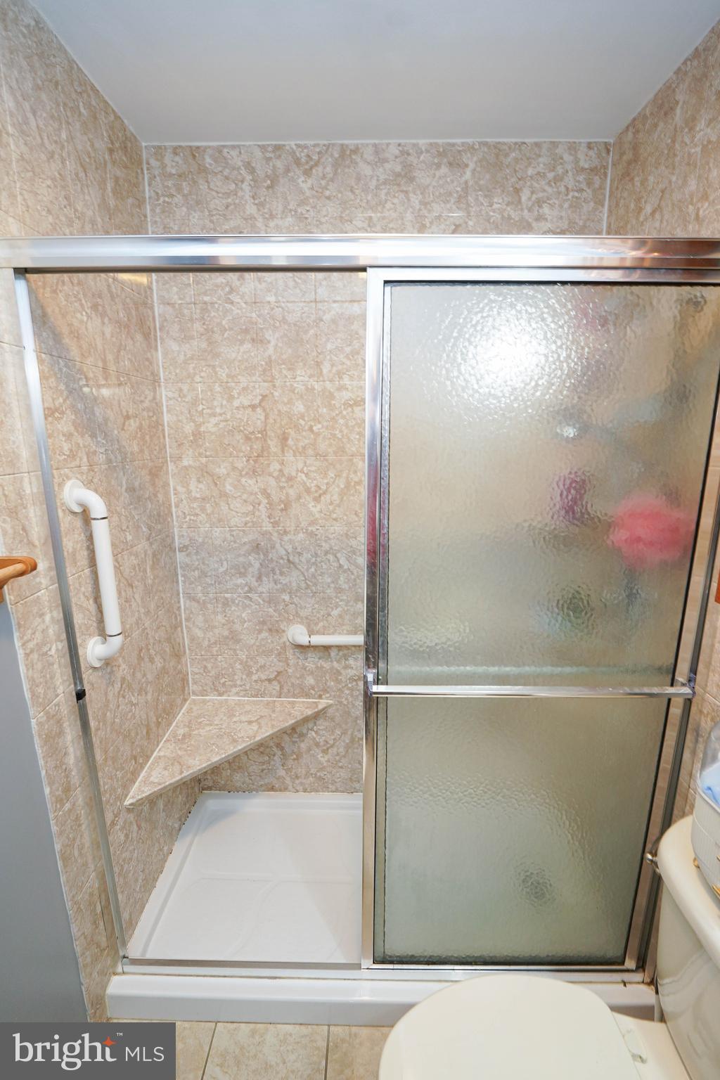 29325 West Line Road Delmar, MD 21875 - Photo 35 of 48 a bathroom with a glass shower door