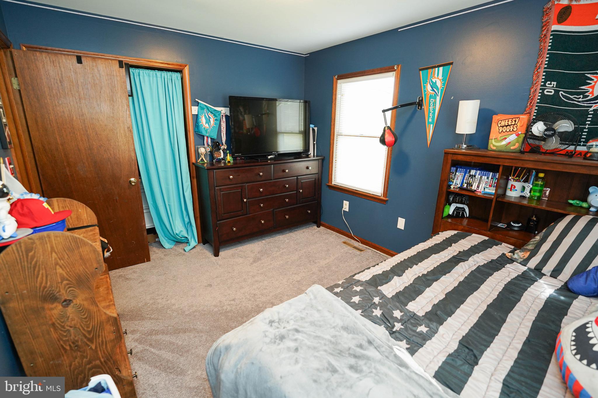29325 West Line Road Delmar, MD 21875 - Photo 37 of 48 a bedroom with a bed and a flat tv screen on dresser