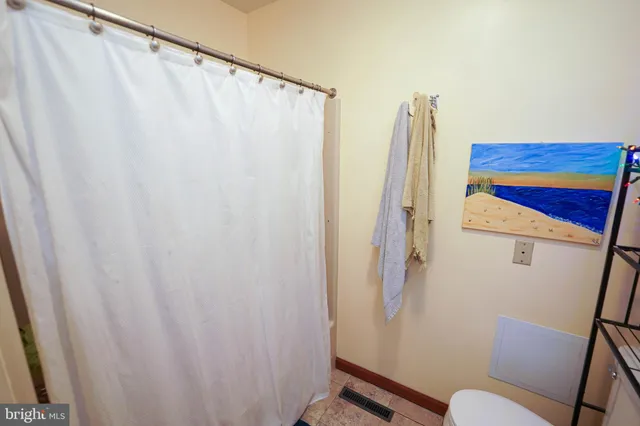 a bedroom with a bed and a chair