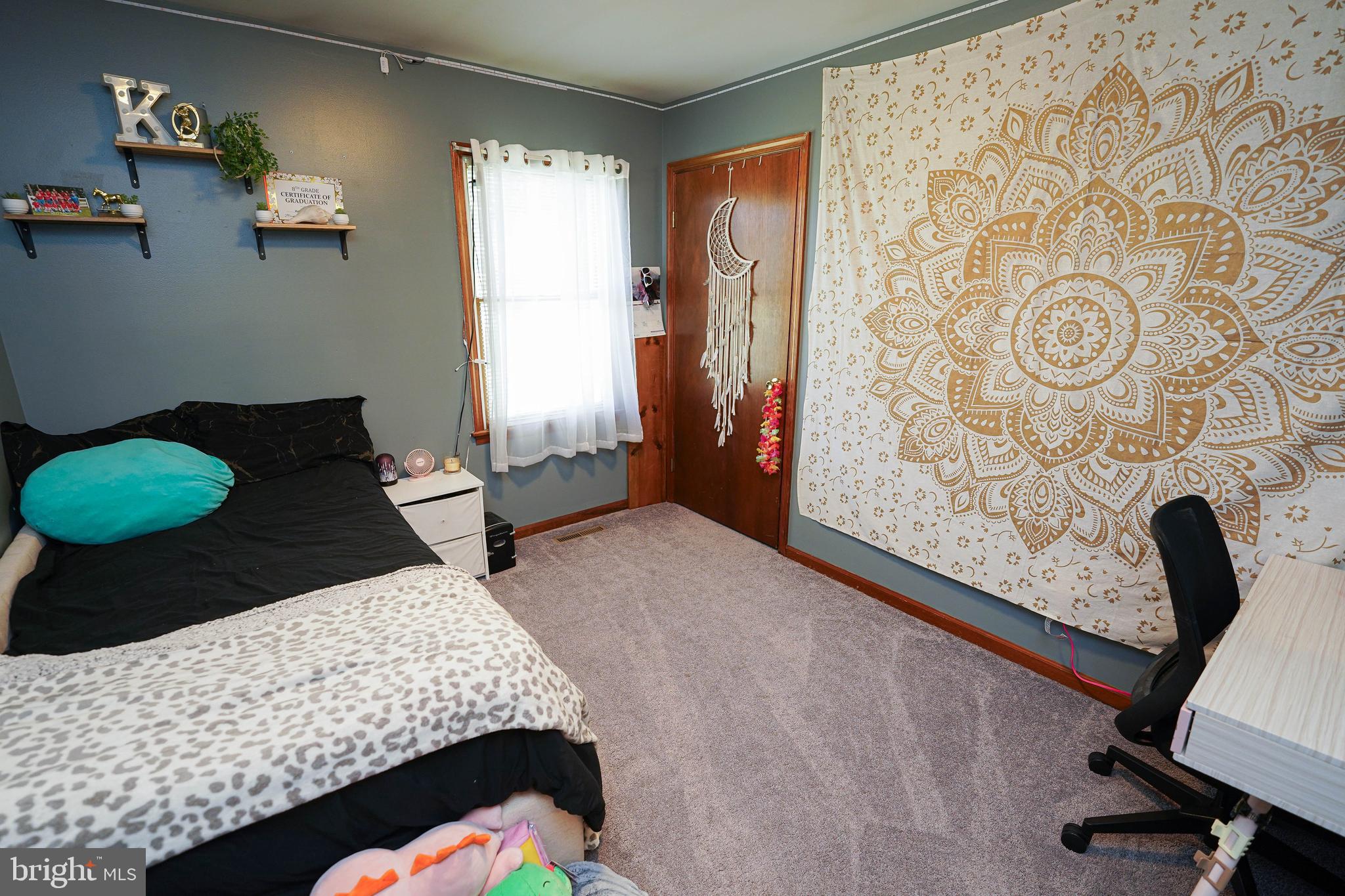 29325 West Line Road Delmar, MD 21875 - Photo 42 of 48 a bedroom with a bed and a chair