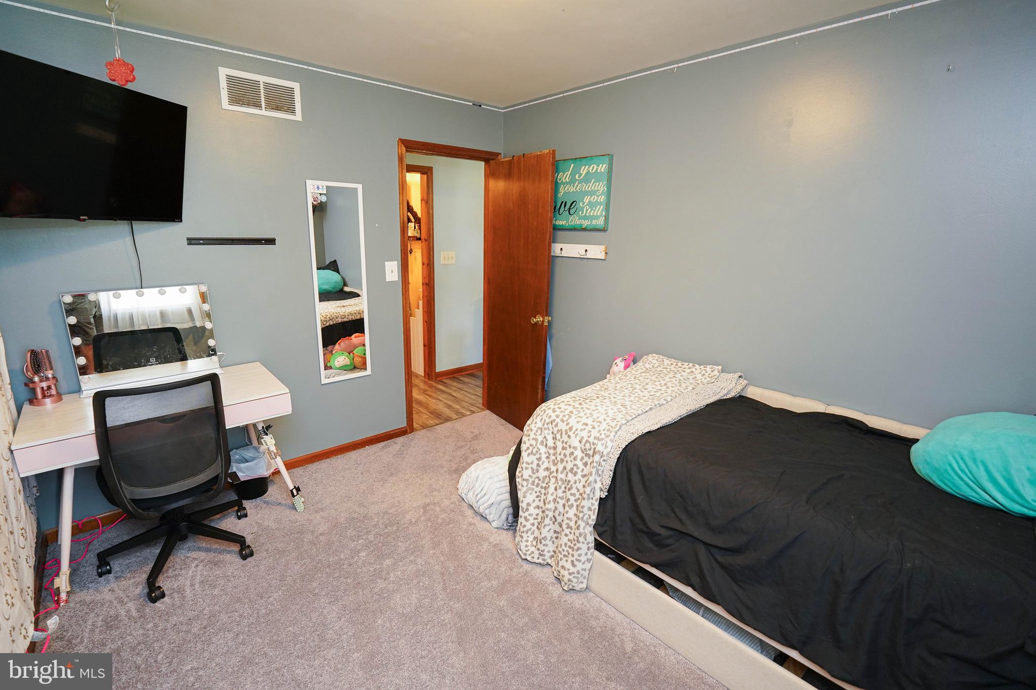 29325 West Line Road Delmar, MD 21875 - Photo 43 of 48 a bedroom with a bed and a flat screen tv