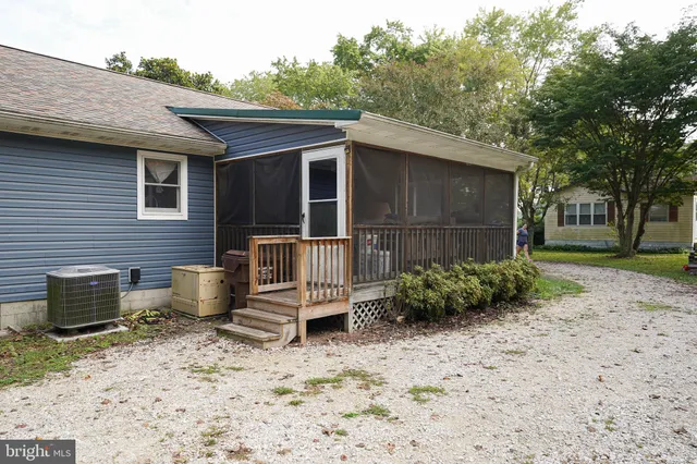 a backyard of a house with barbeque oven