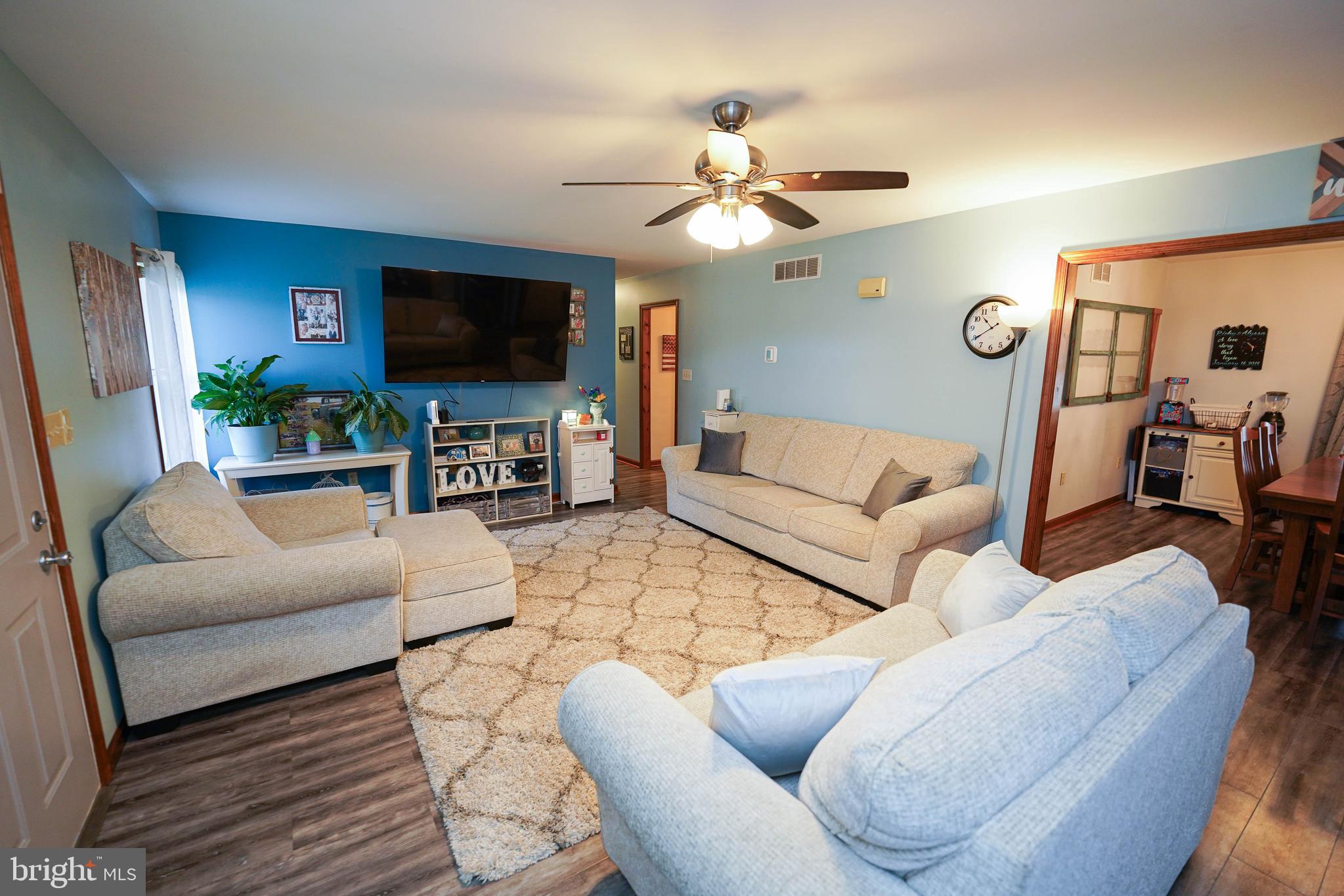 29325 West Line Road Delmar, MD 21875 - Photo 9 of 48 a living room with furniture and a flat screen tv