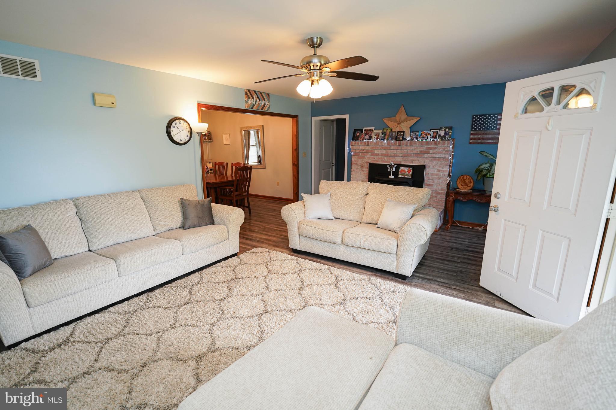 29325 West Line Road Delmar, MD 21875 - Photo 10 of 48 a living room with furniture and a chandelier