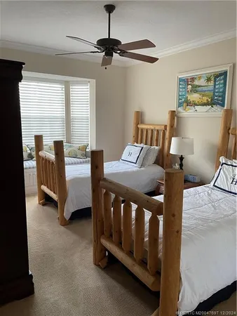 a bedroom with furniture and a window