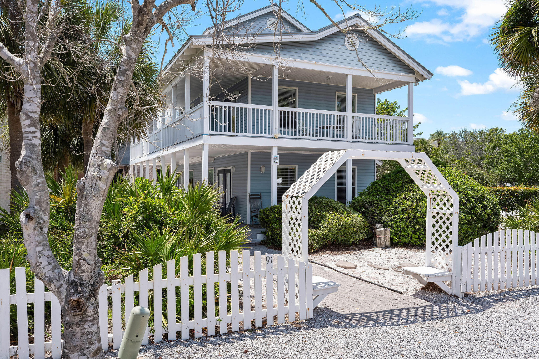 91 Matthew Boulevard Destin, FL 32541 - Photo 14 of 85 a front view of a house with a yard