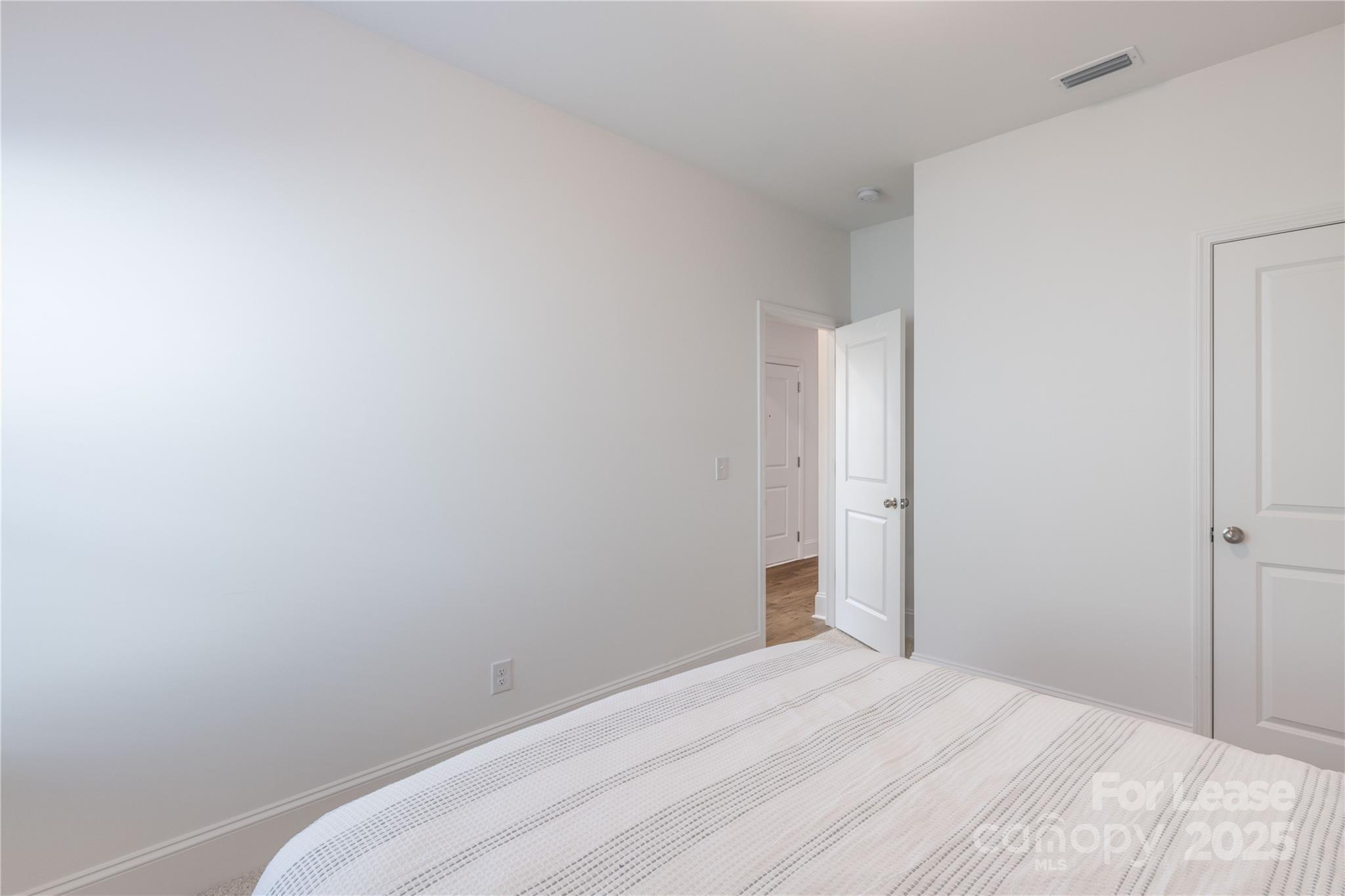 173 Tillery Lane Mount Gilead, NC 27306 - Photo 12 of 28 a view of a room with a white wall and a window