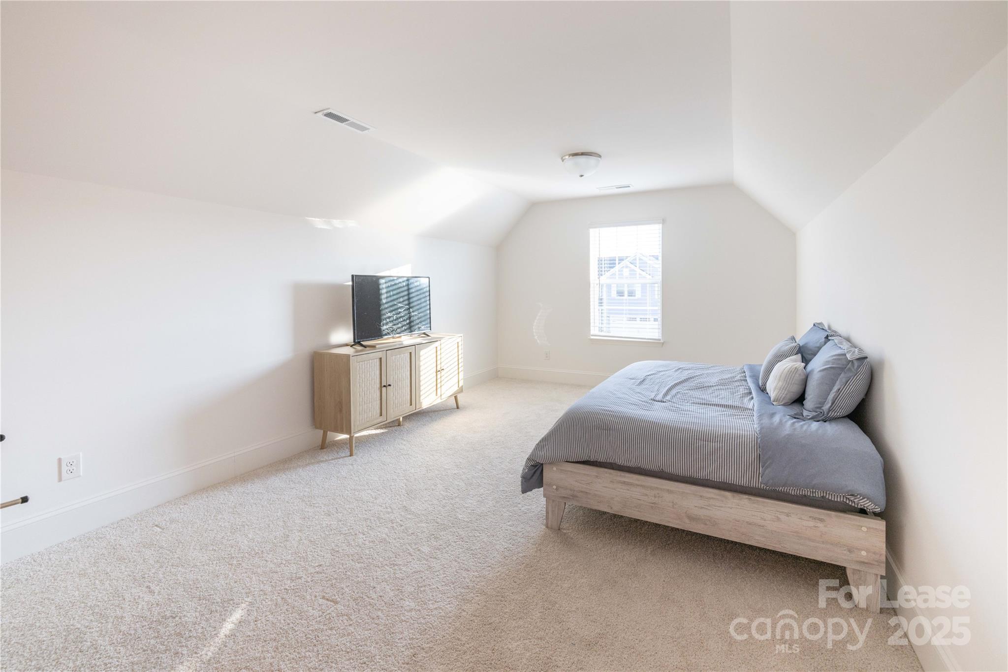 173 Tillery Lane Mount Gilead, NC 27306 - Photo 15 of 28 a bedroom with a bed and window