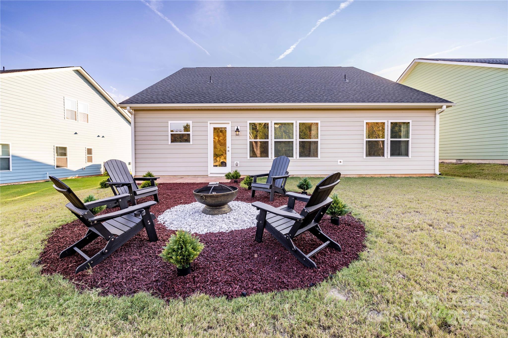 173 Tillery Lane Mount Gilead, NC 27306 - Photo 19 of 28 a view of a house with backyard and sitting area