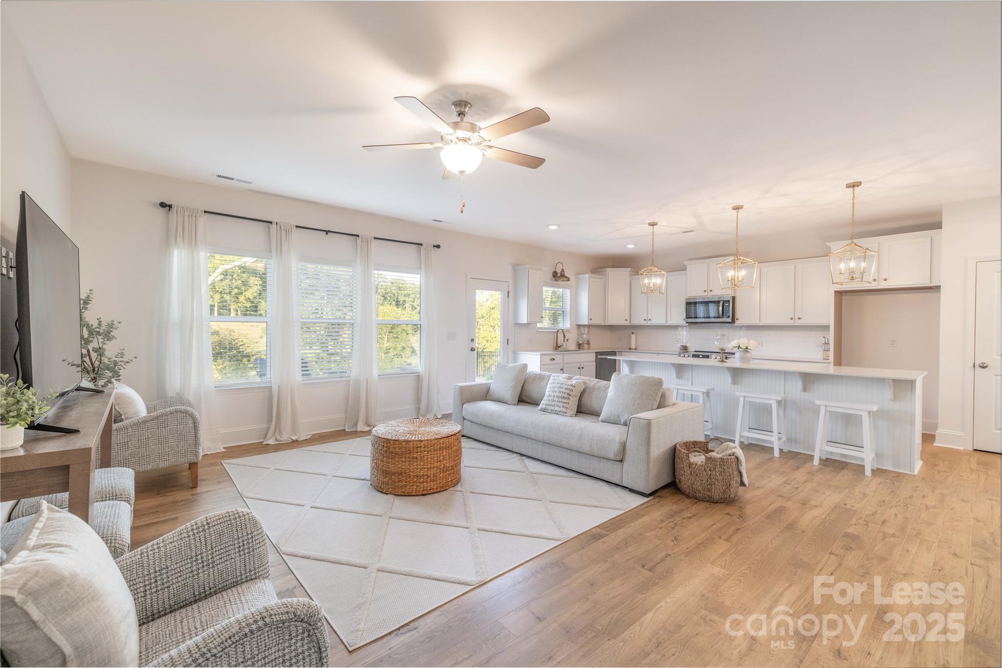 173 Tillery Lane Mount Gilead, NC 27306 - Photo 2 of 28 a living room with furniture and a large window