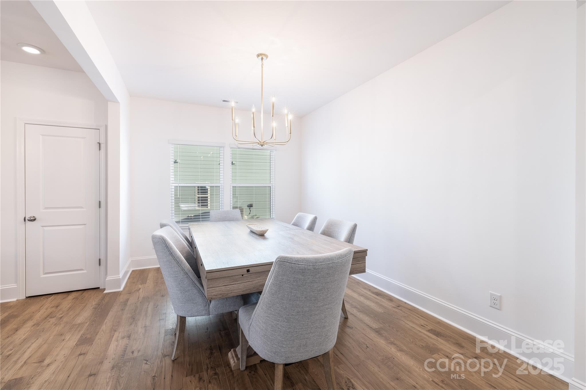 173 Tillery Lane Mount Gilead, NC 27306 - Photo 21 of 28 a view of a dining room with furniture and wooden floor