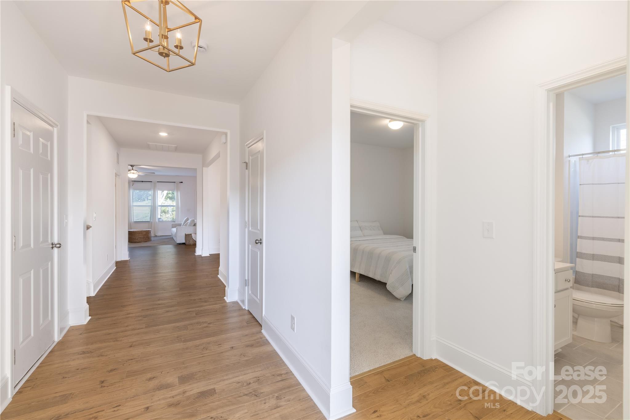 173 Tillery Lane Mount Gilead, NC 27306 - Photo 8 of 28 a view of a hallway with wooden floor and closet