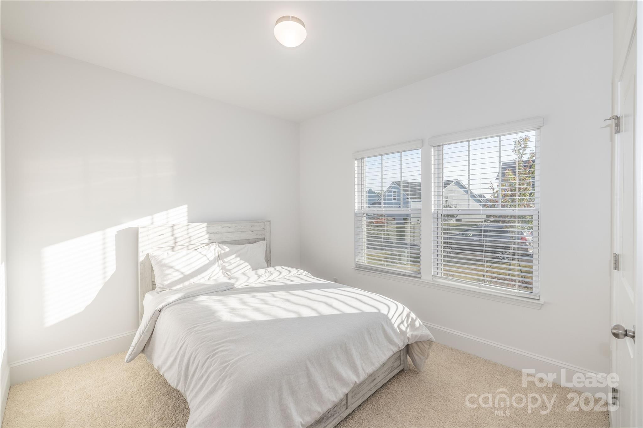 173 Tillery Lane Mount Gilead, NC 27306 - Photo 10 of 28 a bedroom with a bed and a large window