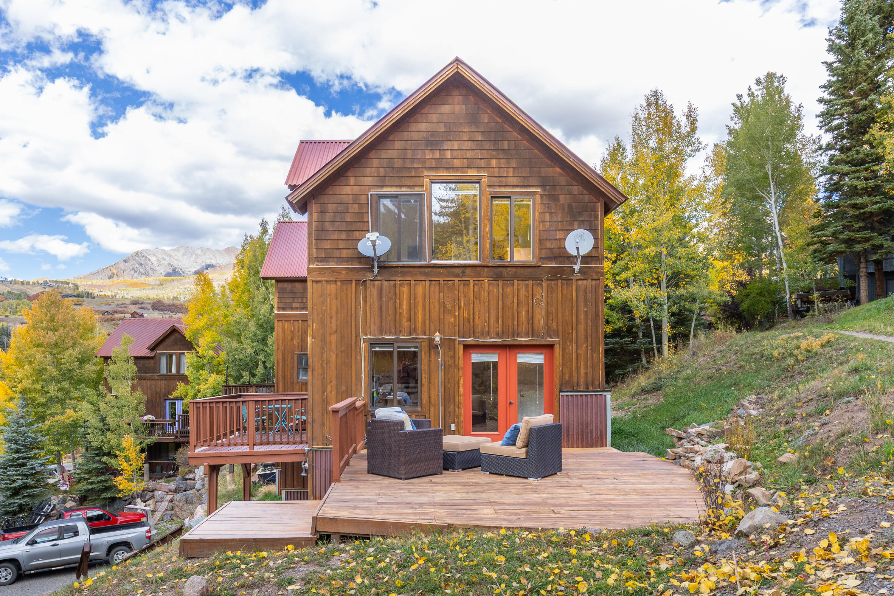 464 San Miguel Ridge, Unit 1 Telluride, CO 81435 - Photo 2 of 27 a front view of a house with garden