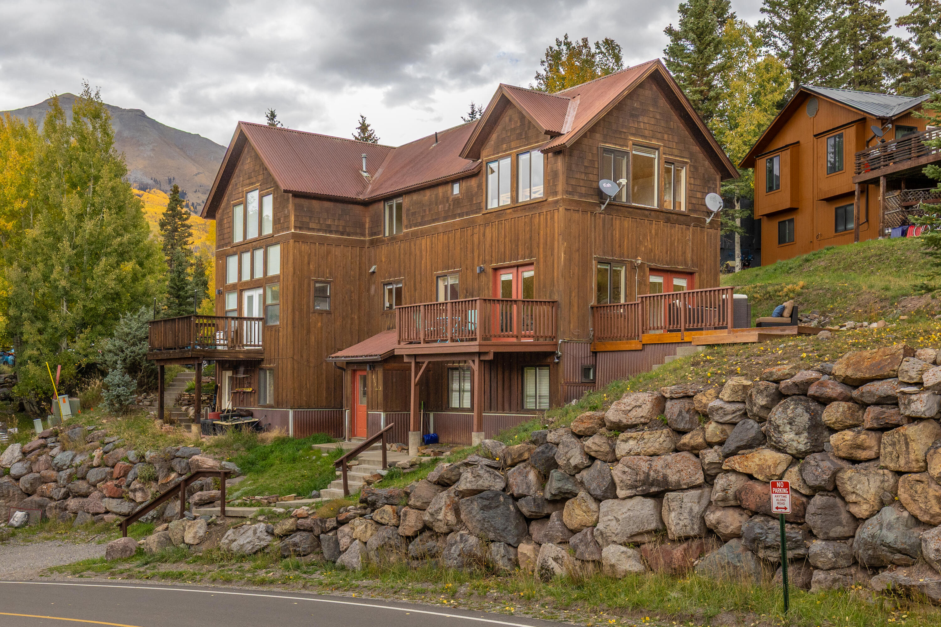 464 San Miguel Ridge, Unit 1 Telluride, CO 81435 - Photo 23 of 27 a front view of a house with a yard