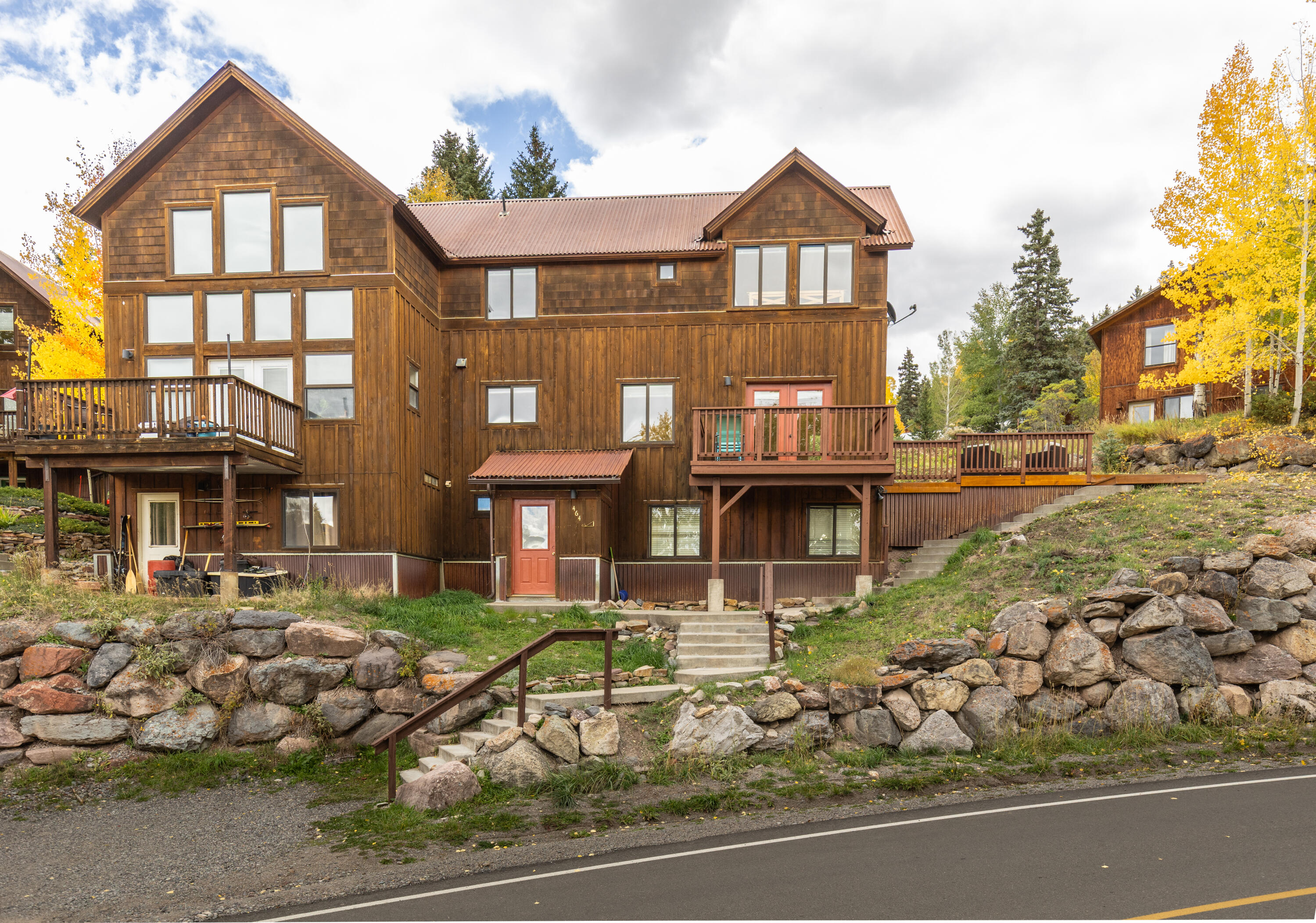 464 San Miguel Ridge, Unit 1 Telluride, CO 81435 - Photo 24 of 27 a front view of a house with a yard