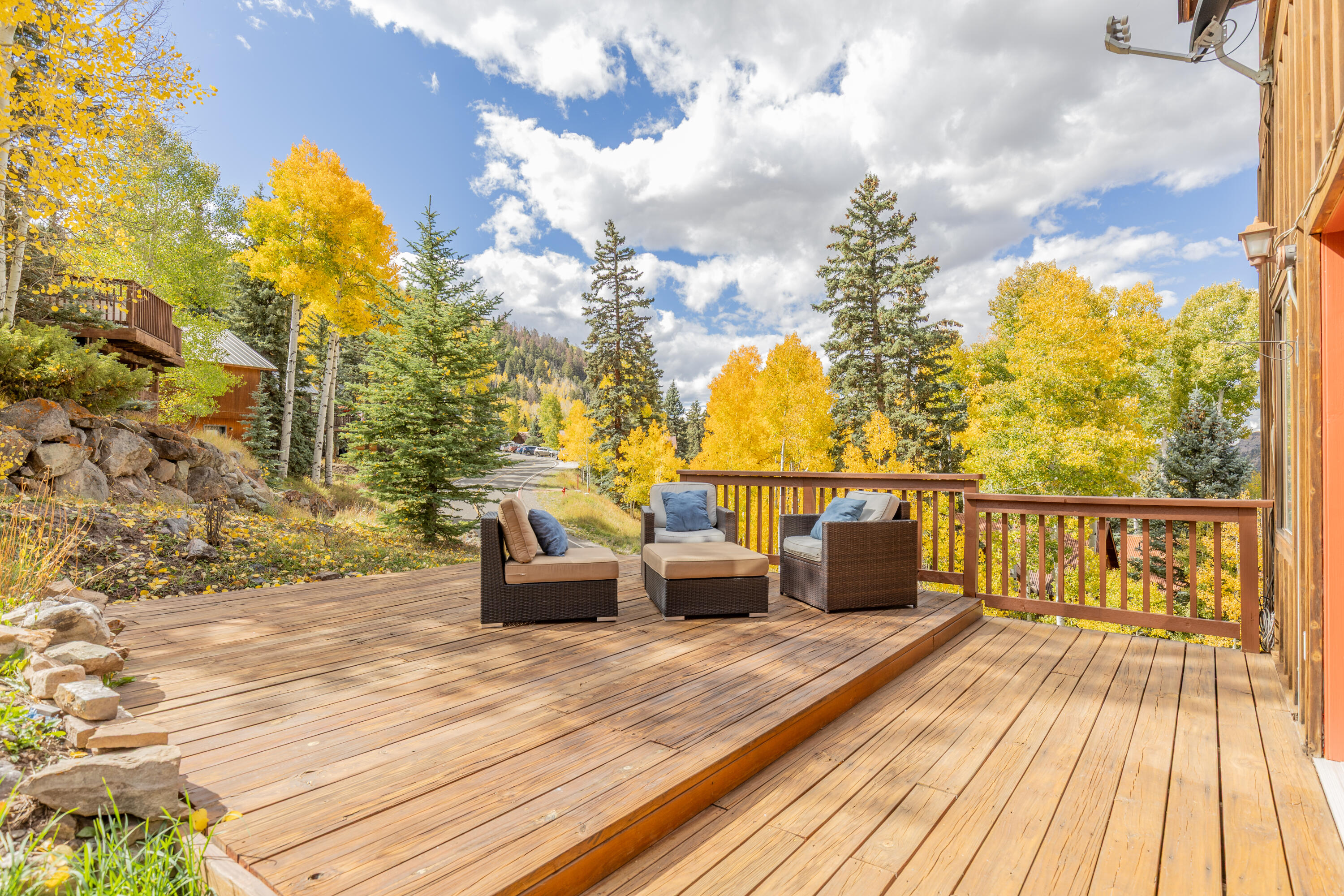 464 San Miguel Ridge, Unit 1 Telluride, CO 81435 - Photo 4 of 27 a view of roof deck with couches and wooden floor